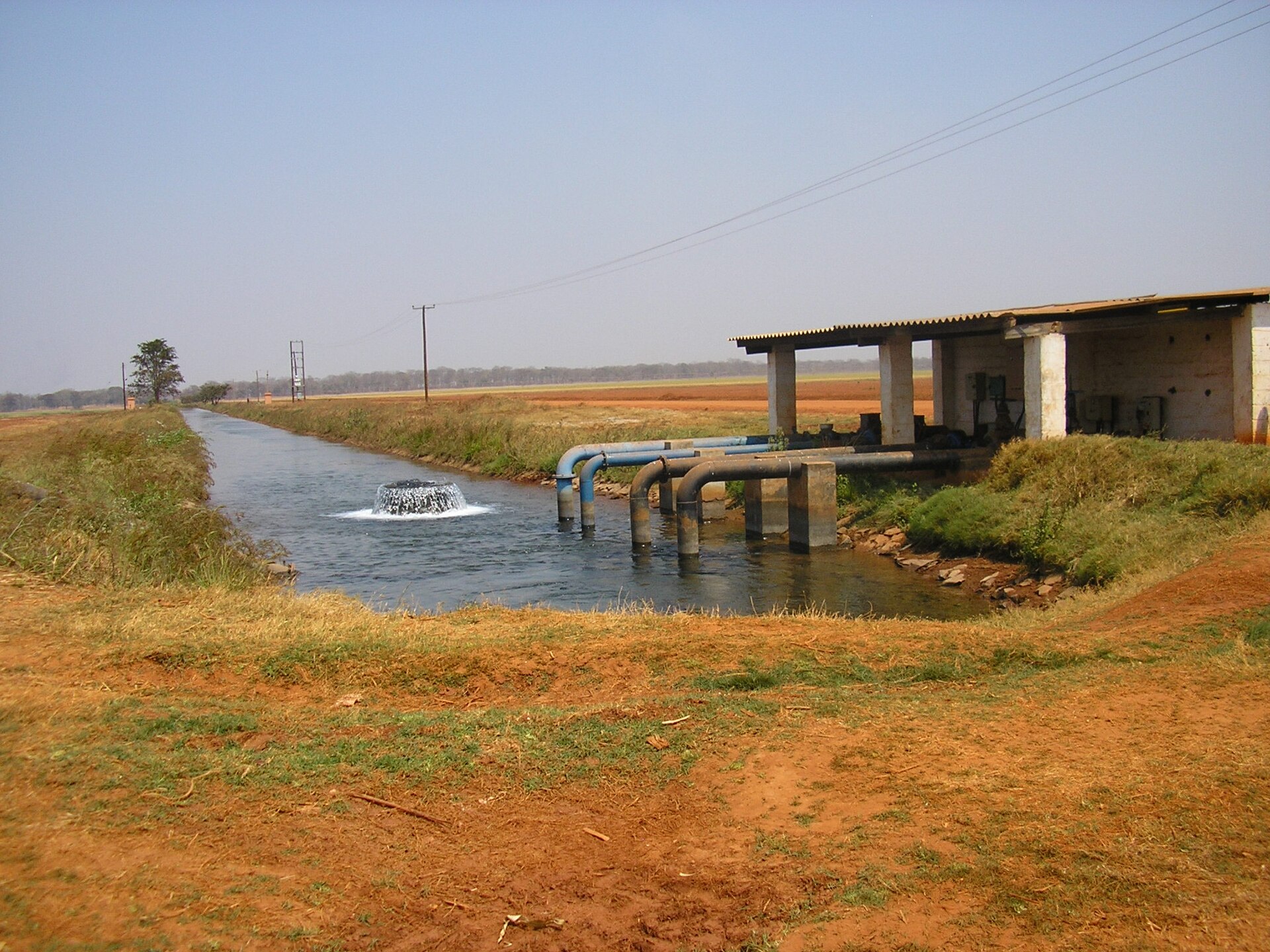 Irrigation canal and pump house. Stock photograph, not a Samanga site