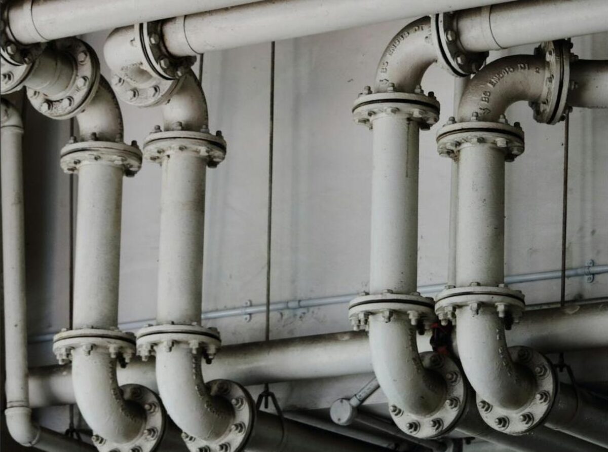 Flanged pipes and valves for water distribution. Stock photograph, not a Samanga site